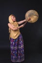 Modern Tribal Woman playing shaman drum