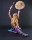 Modern Tribal Woman playing a drum