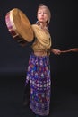 Modern Tribal Woman playing el drum