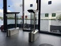 Modern turnstiles and glass exit gates inside river transport terminal with panoramic view of the water. Smart public transport Royalty Free Stock Photo