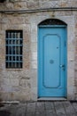 Modern turquois metal door with window and openwork a beautiful vintage background Royalty Free Stock Photo