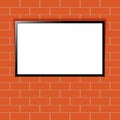 Modern TV with blank screen on red brick wall Royalty Free Stock Photo