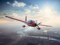 modern two-seat electric plane flies over the city in the sunset