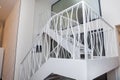 Two-storey iron white stairs for office . Interior of a modern living room with a staircase. Home building interior empty room Royalty Free Stock Photo