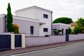 Modern two storey house and garage gate of garden home entrance Royalty Free Stock Photo