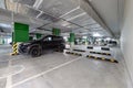 Modern underground parking garage with cars Royalty Free Stock Photo