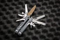 Modern universal army multitool. A tool for all occasions. Gray foam back