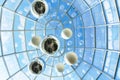 Modern urban abstract architecture glass ceiling in dome shape of a building with transparent roof floating balls imitating planet Royalty Free Stock Photo