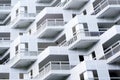 Modern urban apartment building exterior in evening