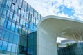 Modern urban architecture. Futuristic building facade against blue sky