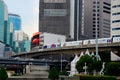 Modern urban image with BTS skytrain transport and skyrise buildings central Bangkok Thailand
