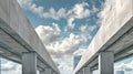 Modern urban infrastructure, concrete overpasses intersecting under blue sky. Architectural symmetry in city transport Royalty Free Stock Photo