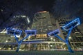 Modern urban street neon illumination with solar photovoltaic panels for power supply of streetlights and surveillance