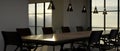 Modern urban stylish dark meeting room or boardroom interior design with formal meeting table