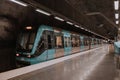 Modern urban transport. The train arrives at a platform in the city metro. Royalty Free Stock Photo