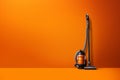 A Modern Vacuum Cleaner Against an Orange Background