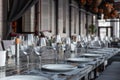 Modern veranda restaurant interior, banquet setting, glasses, plates Royalty Free Stock Photo