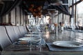 Modern veranda restaurant interior, banquet setting, glasses, plates