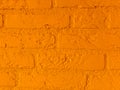 Modern vibrant orange stone brick wall with big bricks close up background pattern Royalty Free Stock Photo