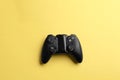 Modern video game controller on color background