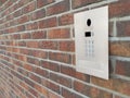 Modern Video Intercom Mounted on Brick Wall Royalty Free Stock Photo