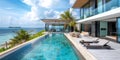 Modern Villa With Large Swimming Pool Next to Ocean Royalty Free Stock Photo