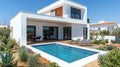 Modern villa with pool and outdoor living space Royalty Free Stock Photo