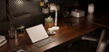 Modern vintage dark workspace with portable tablet mockup on a wooden desk