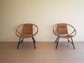 Modern vintage design rattan chairs furniture with white wall backgrounds. Interior design Royalty Free Stock Photo
