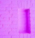 Modern vintage neon purple stone brick wall background with empty framework Royalty Free Stock Photo