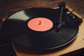 Modern vinyl record player with disc on table, closeup Royalty Free Stock Photo