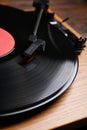 Modern vinyl record player with disc on table, closeup Royalty Free Stock Photo