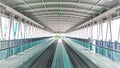 Futuristic Mobility: Modern Escalator Walkway in an International Airport