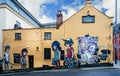 Modern wall art on the side of The Three Tuns Pub in Partition Street, Bristol, Avon, UK Royalty Free Stock Photo