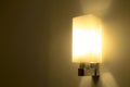 Modern wall lamp with yellow light Royalty Free Stock Photo