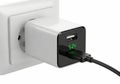 Modern wall-mounted usb charging adapter with green power indicator light Royalty Free Stock Photo