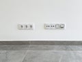 Modern wall with multiple electrical outlets and network ports above a tiled floor Royalty Free Stock Photo