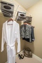 Modern wardrobe closet with clothes