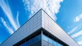 Modern Building Exterior Architectural Design Silver Facade Blue Sky Clouds city metal glass urban lines clean office Royalty Free Stock Photo