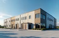 Modern warehouse complex with small office unit. Exterior shows industrial design. Building metal cladding, large loading docks.