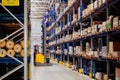 Modern warehouse interior with shelves and boxes and forklift loader Royalty Free Stock Photo