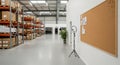 Modern warehouse interior with shelving, boxes, and a ring light setup for content creation Royalty Free Stock Photo