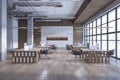 Modern warehouse office interior with window and city view, furniture, wooden flooring and columns. Royalty Free Stock Photo