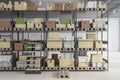 Modern warehouse with racks, boxes and daylight. Logistics and shipping concept.