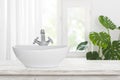 Modern wash basin with shiny faucet on vintage bathroom table Royalty Free Stock Photo