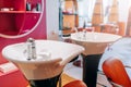 Modern wash basins in hairdressing salon, nobody Royalty Free Stock Photo