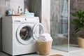 White Front Load Washing Machine Isolated on White Background. Modern Washer with Electronic Control Panel. Side View of Household Royalty Free Stock Photo