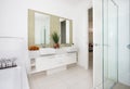 Modern washroom with the door opened and white walls