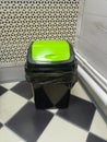Modern Waste Bin with Lime Green Lid in Geometric Interior Setting Royalty Free Stock Photo