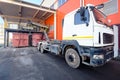 At modern waste recycling plant yard, process of loading sorted garbage from conveyor belt into container for further